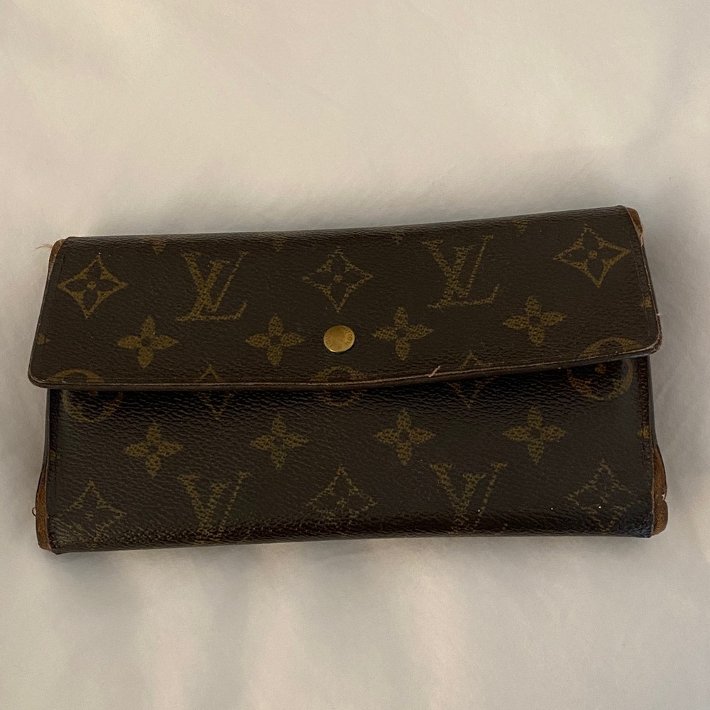 Authentic Louis Vuitton Brown and Gold Monogram wallet.